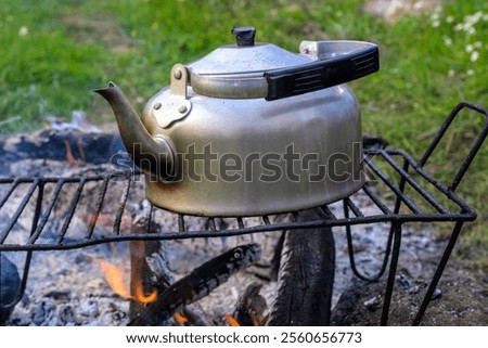 Image, Stock Photo Kettle placed on campfires in snowy woods at sundown