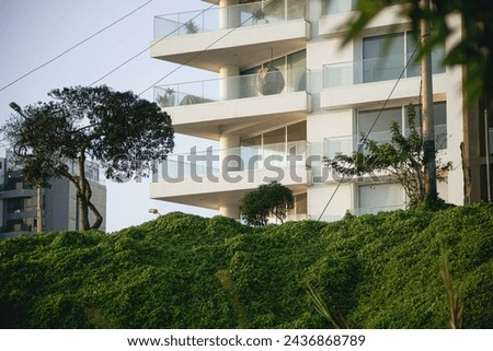 Similar – Image, Stock Photo Two multistory buildings standing face to face.