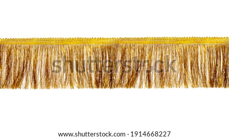 The fringe is golden with a long thin pile. Isolated on white background. Decor, design, decoration, texture. Stockfoto © 