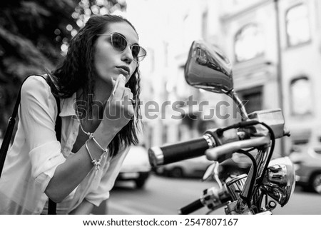 Similar – Image, Stock Photo Woman applying lipstick near car mirror