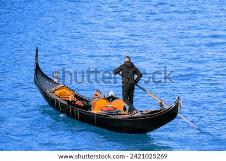 Similar – Image, Stock Photo A gondolier in his gondola on the Grand Canal in Venice