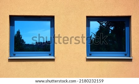 Similar – Foto Bild Ein kleines Fenster mit Gardiene in einer mit wildem Wein bewachsenen Mauer im Winter