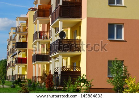 newly inhabited yellow block of flats and apartments
