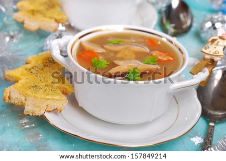 cream cep soup with  christmas tree`s shape cheese toast on festive table