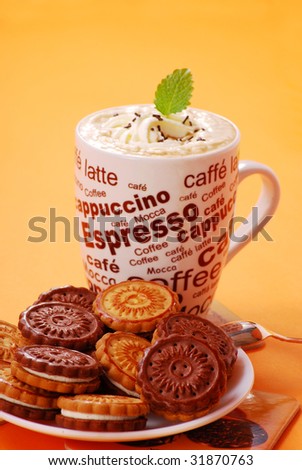 cappuccino coffee with cream and cookies