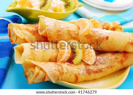 rolled pancakes with orange,kiwi and cottage cheese