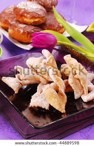 deep-fried pastries with icing sugar and donuts for carnival party