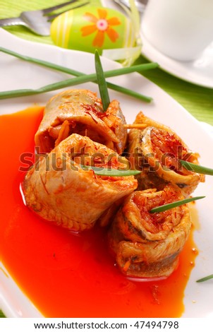 herring rolls in salsa sauce with saffron for easter