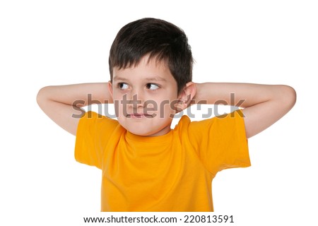 A closeup portrait of a dreaming young boy on the white background