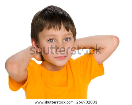 A portrait of a cute little boy dreams against the white background