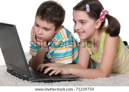 A Boy And A Girl Are Studying Using A Laptop; Isolated On The White ...