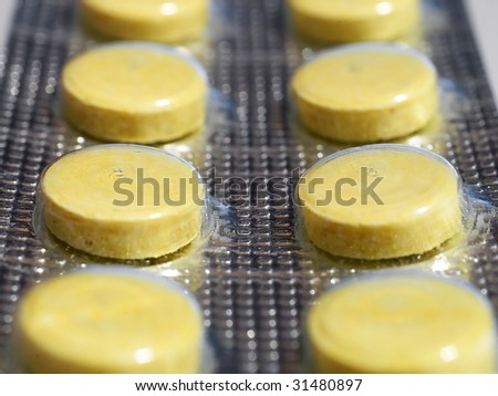Yellow pills in blister package