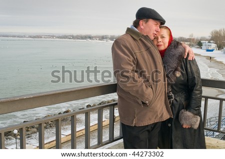 Elderly loving couple in the winter during rest.