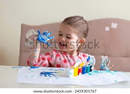 Similar – Image, Stock Photo Girl playing with mosaic board game