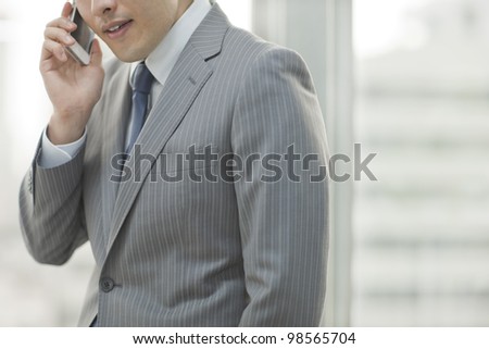 The businessman who talks on the telephone