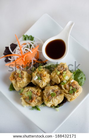 Shumai. Steamed homemade shrimp and chicken dumpling with house soy sauce