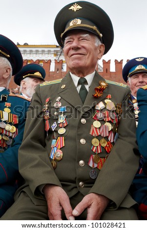 MOSCOW - MAY 9: Unidentified smiling World War II veteran of missile troops on Victory Day celebration on Red Square, May 9, 2011, Moscow, Russia. Veteran is awarded with many orders and medals.