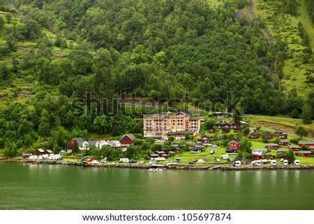 GEIRANGER - JUNE 26: Grande Fjord Hotel in small coastal village on JUNE 26, 2011 in Gieranger, Norway. Hotel located near Geiranger fjord, carried on UNESCO World Heritage List.