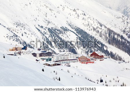 Top view of several hotels in mountains at winter. Picturesque landscape.