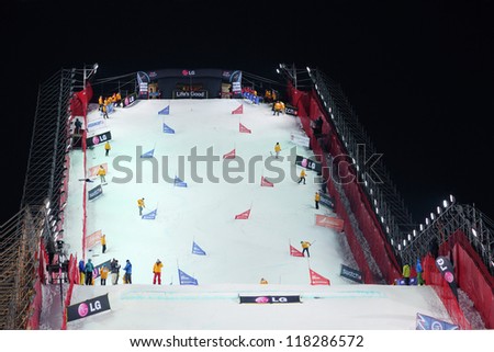 MOSCOW - MARCH 3: Stewards clean ramp at Snowboard World Cup in Luzhniki sports complex on March 3, 2012 in Moscow, Russia.