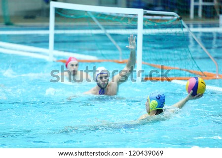 MOSCOW - MARCH 3: Men play water polo in pool at 7th round match of Russian Championship in water polo in Olimpiysky Sports Complex on March 3, 2012 in Moscow, Russia.