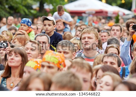 MOSCOW - JUN 23: People at concert of Chaif rock-band during VII traditional festival of live sound Music of Summer in Hermitage Garden, Jun 23, 2012, Moscow, Russia.
