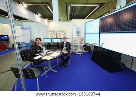 MOSCOW - MAY 15: Representatives of company Communications and telemechanics system at transport exhibition at VVC, May 15 2012, Moscow Russia. In exposition of exhibition was attended by 65 companies