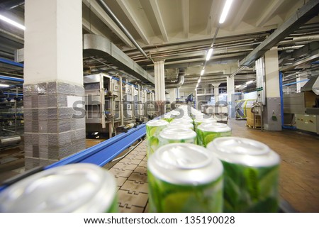 MOSCOW - MAY 16: Cans with drink mojito on conveyor in Ochakovo factory, on May 16, 2012 in Moscow, Russia. Ochakovo - is one of most modern plants, not only in Russia but also in Europe.