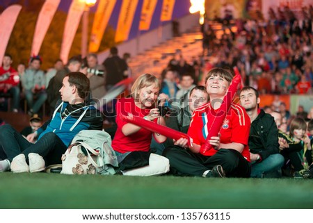 MOSCOW - JUN 8: Russian fans gathered in Fanzone in All-Russian Exhibition Center to support national team on UEFA EURO 2012, on Jun 8, 2012 in Moscow, Russia