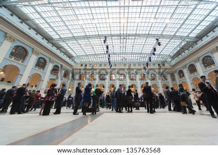 MOSCOW - APR 12: People go in Gostini dvor before Ceremony of rewarding of winners of an award Brand of year of EFFIE 2011, on April 12, 2012 in Moscow, Russia