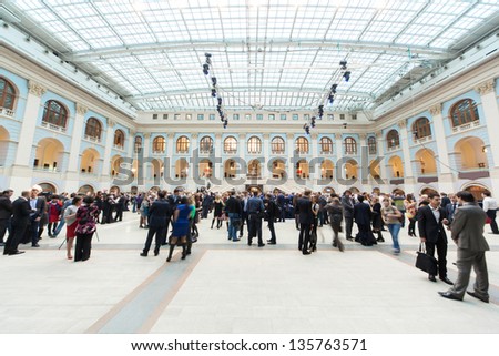 MOSCOW - APR 12: People walk in Gostini dvor before Ceremony of rewarding of winners of an award Brand of year of EFFIE 2011, on April 12, 2012 in Moscow, Russia