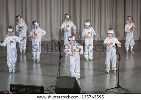 MOSCOW - APR 4: Boys in costumes of astronauts performs on stage on District Competition Crystal droplet on April 7, 2012 in Moscow, Russia.