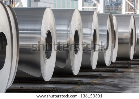 Rolls of aluminum close up in production shop of plant.