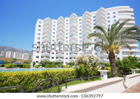 ALANYA - JULY 5: Palm and building of My Marine Residence residential complex, on July 5, 2012 in Alanya, Turkey. Total area of residential complex My Marine Residence is 45 000 square meters.