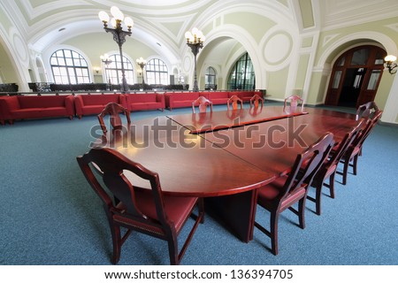 MOSCOW - MAY 23: Wooden table in Commerce and Industrial chamber of Russia, May 23, 2012 Moscow, Russia. Congress center of Commerce and Industrial chamber has conference room of 370 square meters