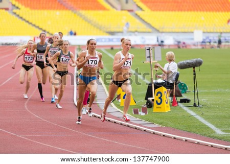 MOSCOW - JUN 11: Athletes run in circles on International athletic competition Moscow Challenge on June 11, 2012 in Luzhniki, Moscow, Russia
