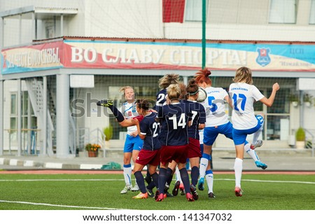 MOSCOW - AUG 23: Struggle for ball on soccer field during match between female teams CSP Izmailovo (Moscow) and Mordovochka (Saransk) at stadium of CSP Izmailovo, August 23, 2012, Moscow, Russia.