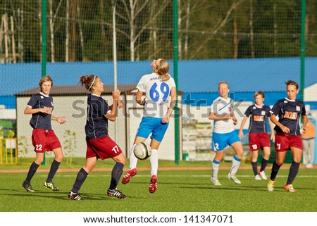 MOSCOW - AUG 23: Struggle for ball on field during match between female teams CSP Izmailovo (Moscow) and Mordovochka (Saransk) at stadium of CSP Izmailovo, August 23, 2012, Moscow, Russia.