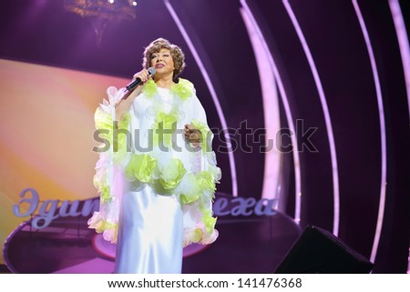 MOSCOW - OCTOBER 14: Singing Edyta Piecha in white at her anniversary concert in Kremlin Palace, on October 14, 2012 in Moscow, Russia. Famous Russian singer Edita Piecha is 75 years.