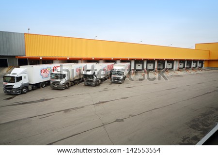 MOSCOW - OCT 16: Trucks loaded in stock in brewery Ochakovo on October 16, 2012 in Moscow, Russia. Ochakovo is largest Russian company beer and soft drinks industry without foreign capital