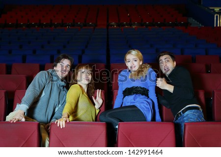 Four young scared friends see movie in cinema theater and move back in fear.
