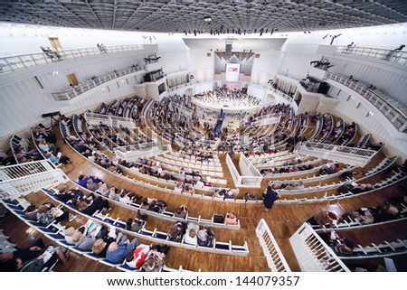 MOSCOW - SEPTEMBER 8: Above view of people sit down on seats prior to IV Grand Festival of Russian National Orchestra in Tchaikovsky Concert Hall, on September 8, 2012 in Moscow, Russia.