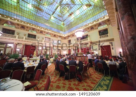 MOSCOW - DEC 4: People in suits eat at an expensive restaurant Metropol with chic interior on December 4, 2012 in Moscow, Russia.