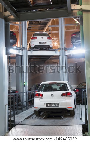 MOSCOW - JAN 11: The Volkswagen Golf on lift in tower for store cars in Volkswagen Center Varshavka January 11, 2013, Moscow, Russia. The tower was designed and built in 2009