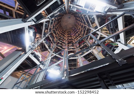 MOSCOW - JAN 11: Bottom view in transparent construction for car storage at night in Varshavka Center on January 11, 2013, Moscow, Russia. The tower was designed and built in 2009