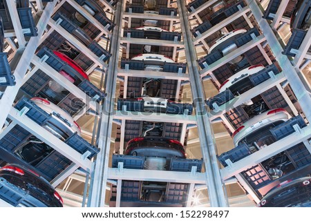 MOSCOW - JAN 11: Platforms with cars arranged in a circle in transparent tower at night in Varshavka Center at night on January 11, 2013, Moscow, Russia. The tower was designed and built in 2009