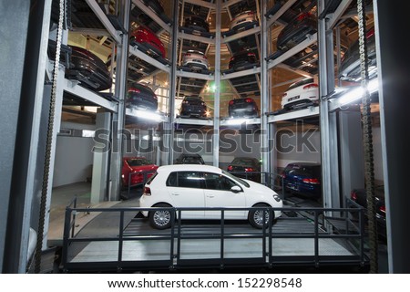 MOSCOW - JAN 11: The Volkswagen Golf on parking lot with a multi-story automated car parking system in Volkswagen Center Varshavka at night on January 11, 2013, Moscow, Russia