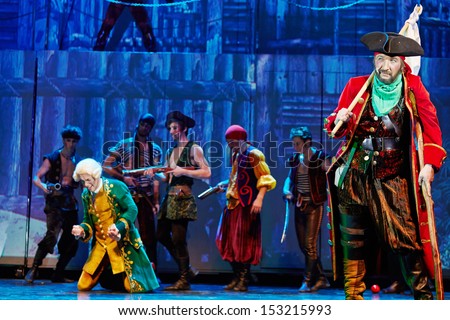 MOSCOW - DEC 15: John Silver and his pirates in scene from musical spectacle for children Treasure Island on stage at Big Concert Hall Izmailovo, December 15, 2012, Moscow, Russia.