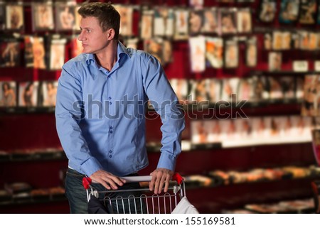 A man with a cart in lingerie store