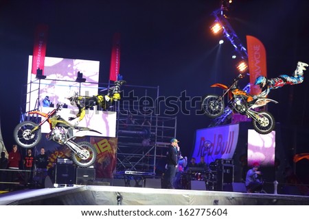 MOSCOW - MAR 02: Simultaneous jump motorcyclists on the festival extreme sports Breakthrough 2013 in the arena of the Olympic Sports Complex, on March 02, 2013 in Moscow, Russia.